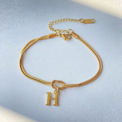 A-Z Love Knot Bracelet – Personalized Gold Charm