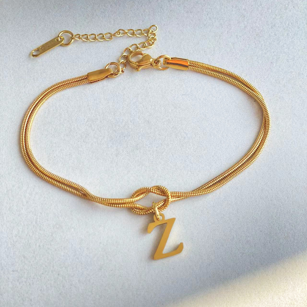 A-Z Love Knot Bracelet – Personalized Gold Charm