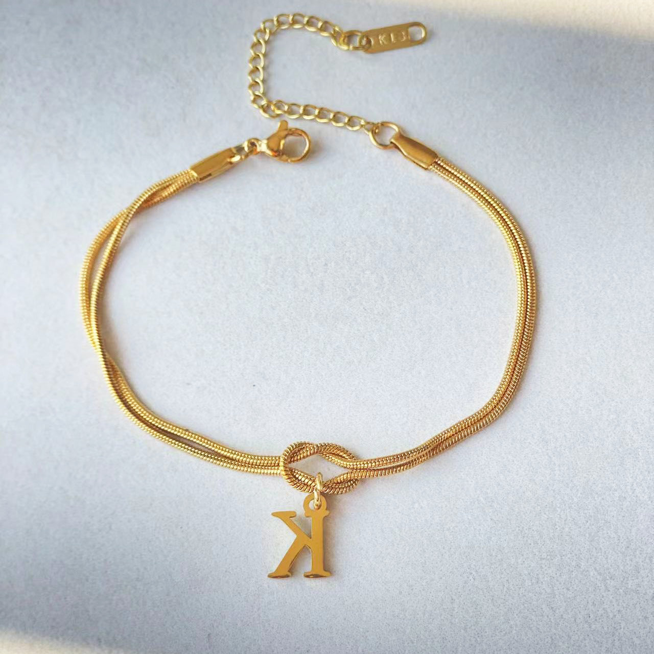 A-Z Love Knot Bracelet – Personalized Gold Charm