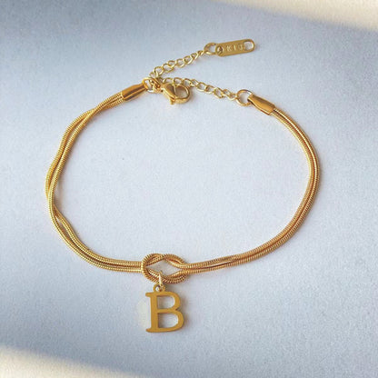 A-Z Love Knot Bracelet – Personalized Gold Charm